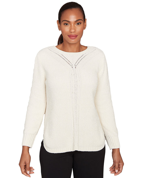 Woman wearing a cream-colored sweater with a subtle pattern on a white background