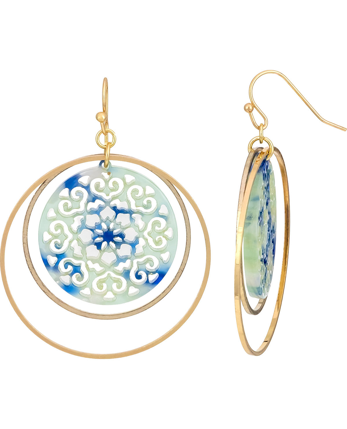 A pair of gold-tone dangle earrings with double concentric hoop rings and oval charms featuring a blue and white floral mandala design on a white background.
