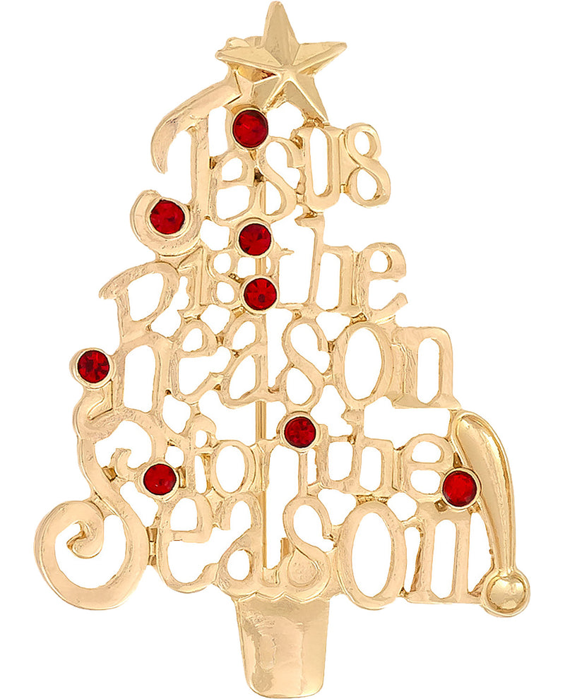 A gold Christmas tree-shaped candlestick with the phrase 'Jesus is the reason for the season' in cutout lettering, accented with red gemstone ornaments and a star on top, shown on a plain white background.
