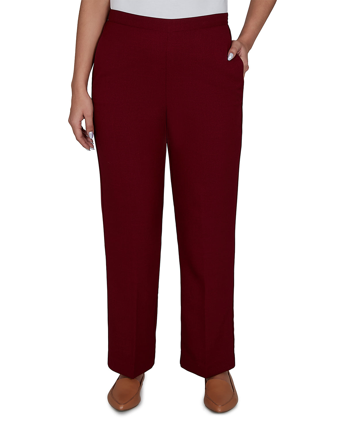 Maroon pants worn by a person on a white background