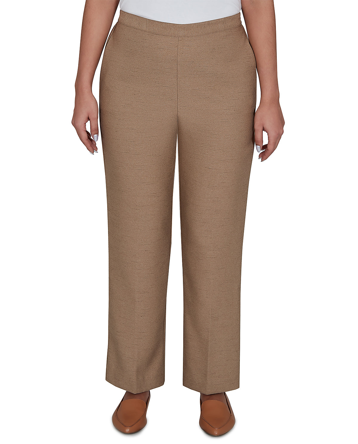 Brown pants worn by a person on a white background