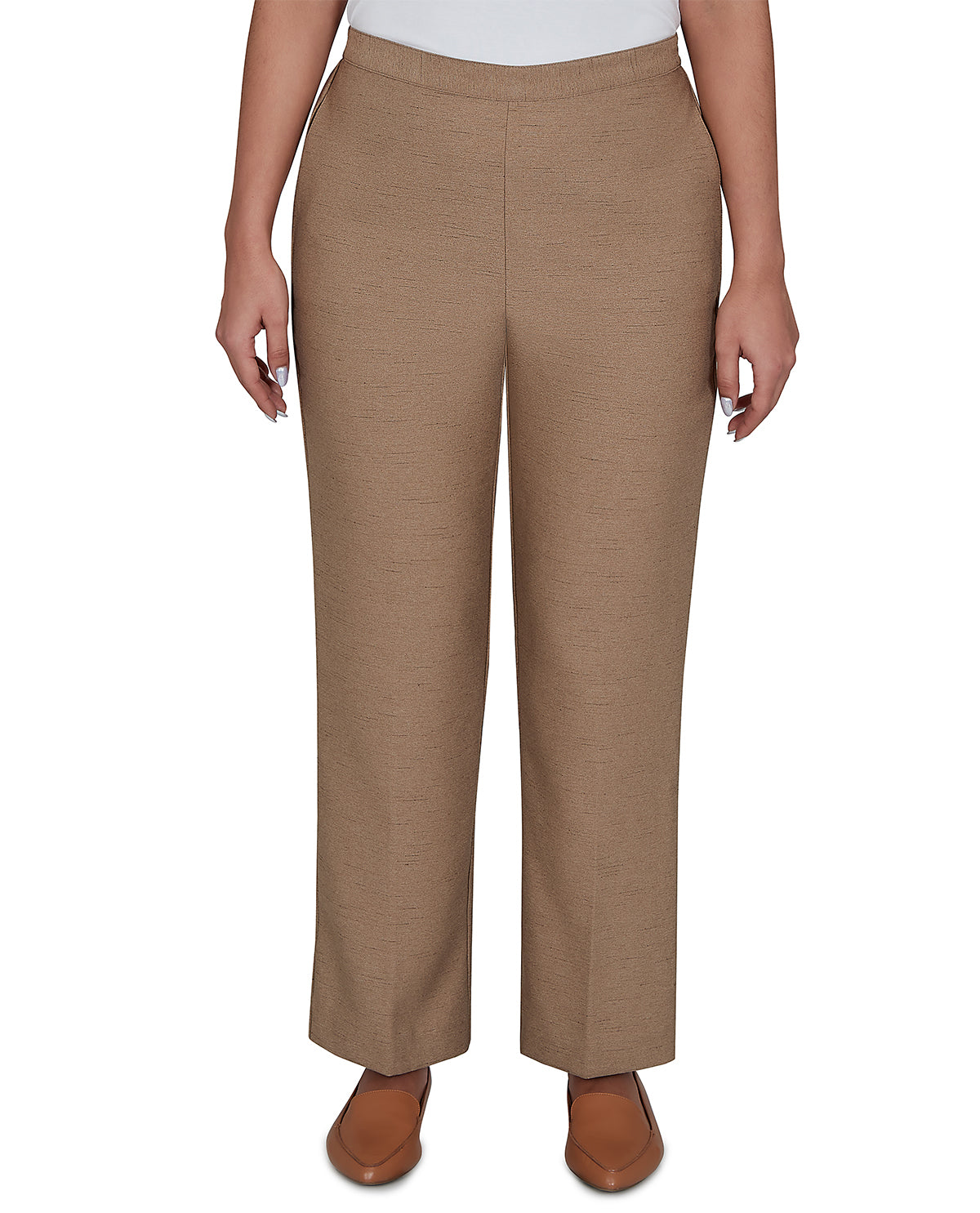 Brown pants worn by a person on a white background