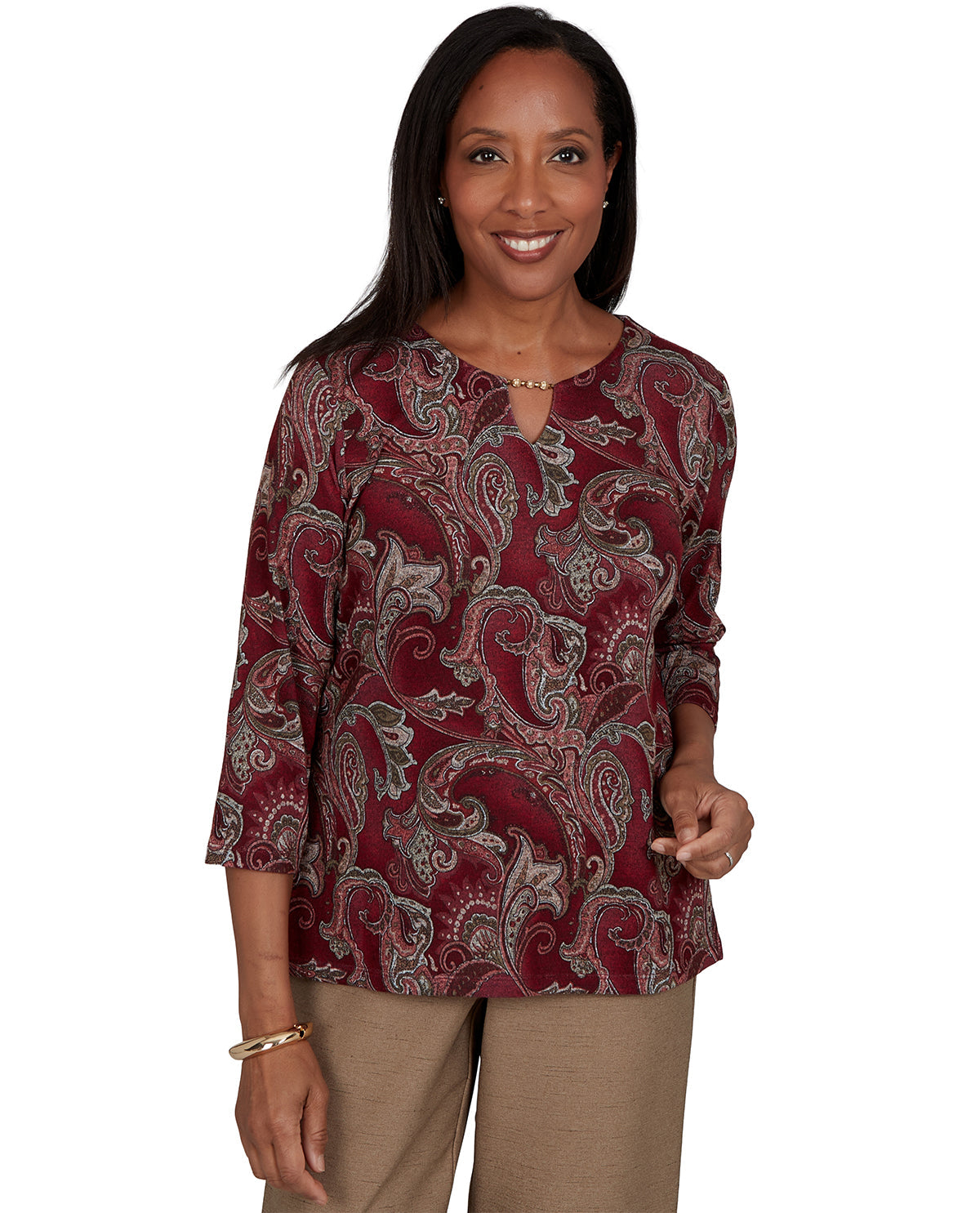 Woman wearing a patterned blouse on a white background