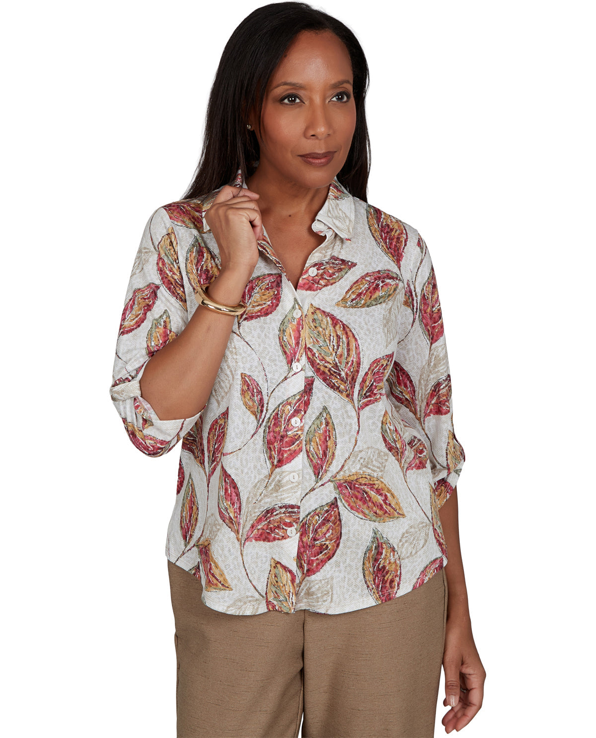 Woman wearing a patterned blouse with a white background