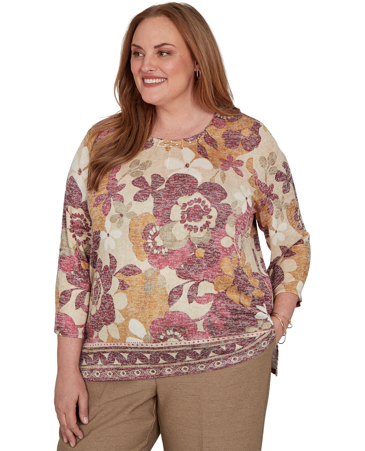 Woman wearing a floral patterned top on a white background