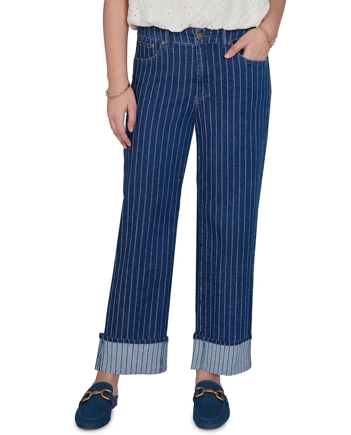 Person wearing blue pinstripe pants with a white top on a white background