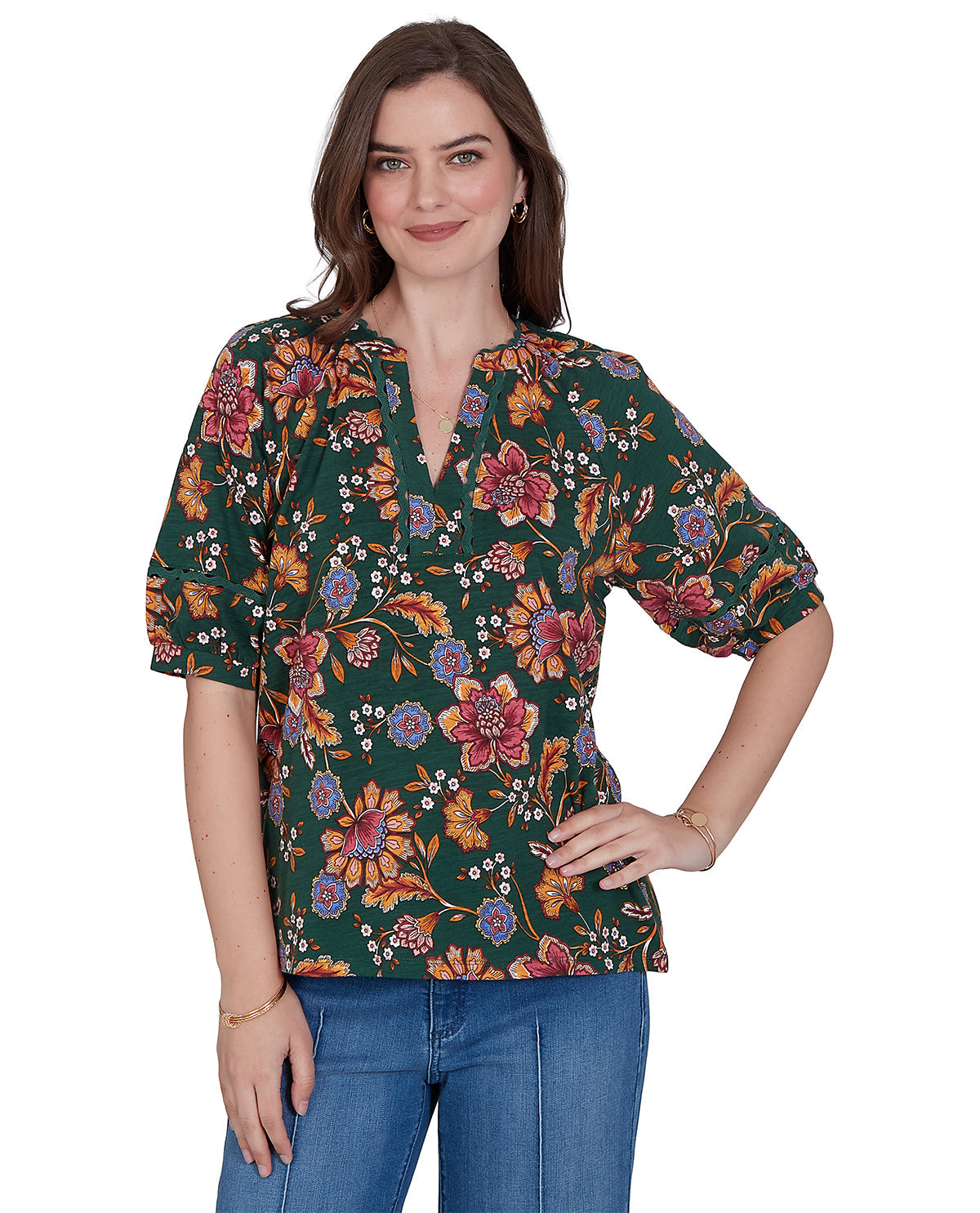 Woman wearing a floral blouse with a white background