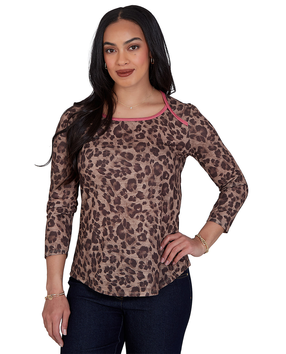 Woman wearing a leopard print long-sleeve top with pink trim on a white background