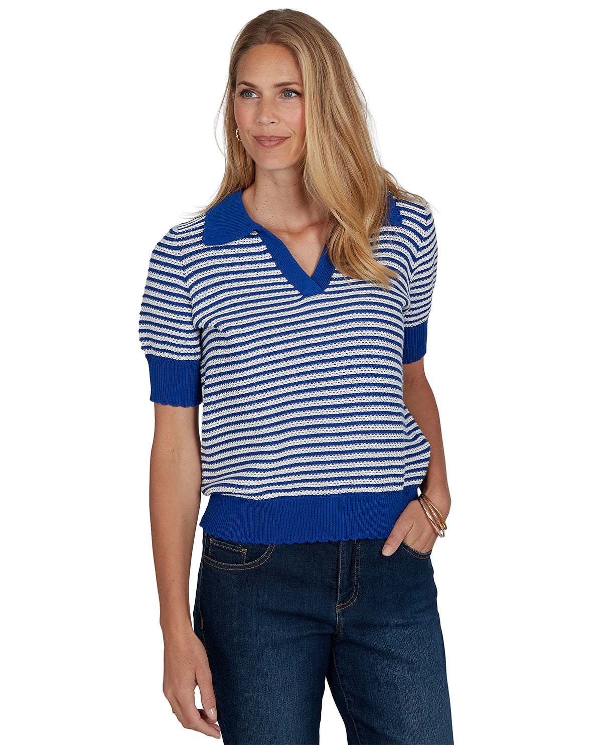 Woman wearing a blue and white striped shirt with a blue collar on a white background