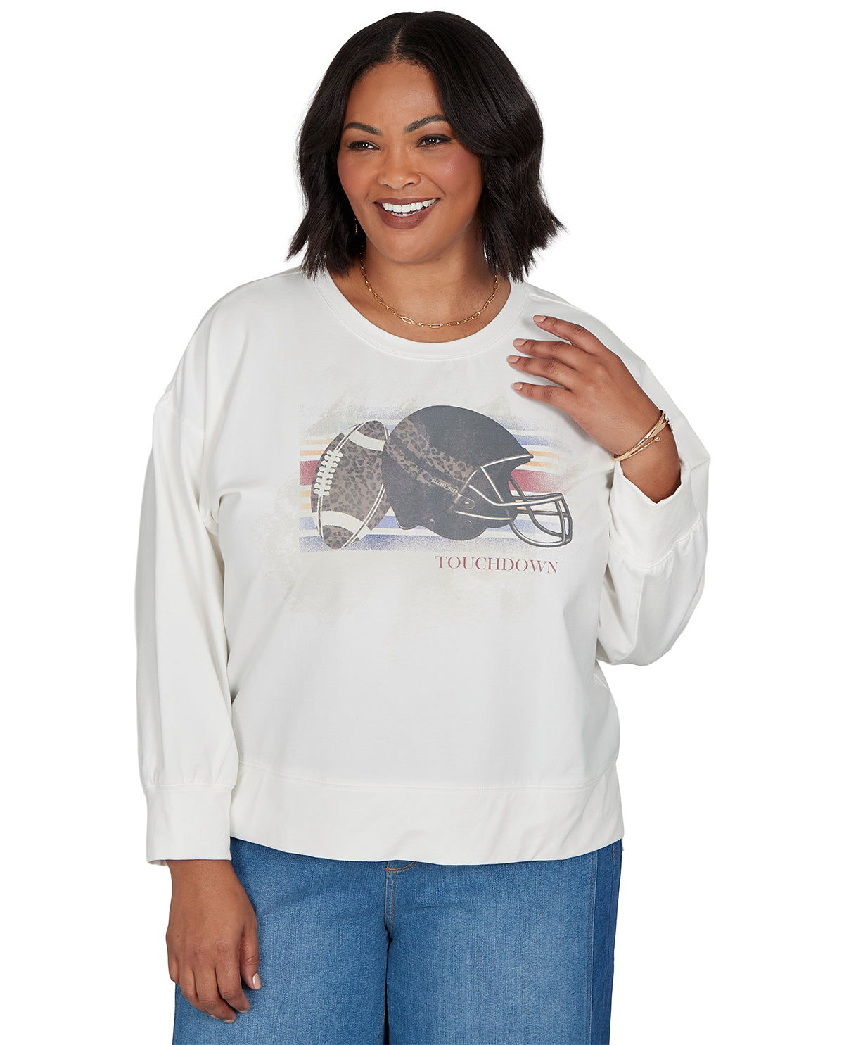 Woman wearing a white sweatshirt with a football graphic and 'Touchdown' text on a white background