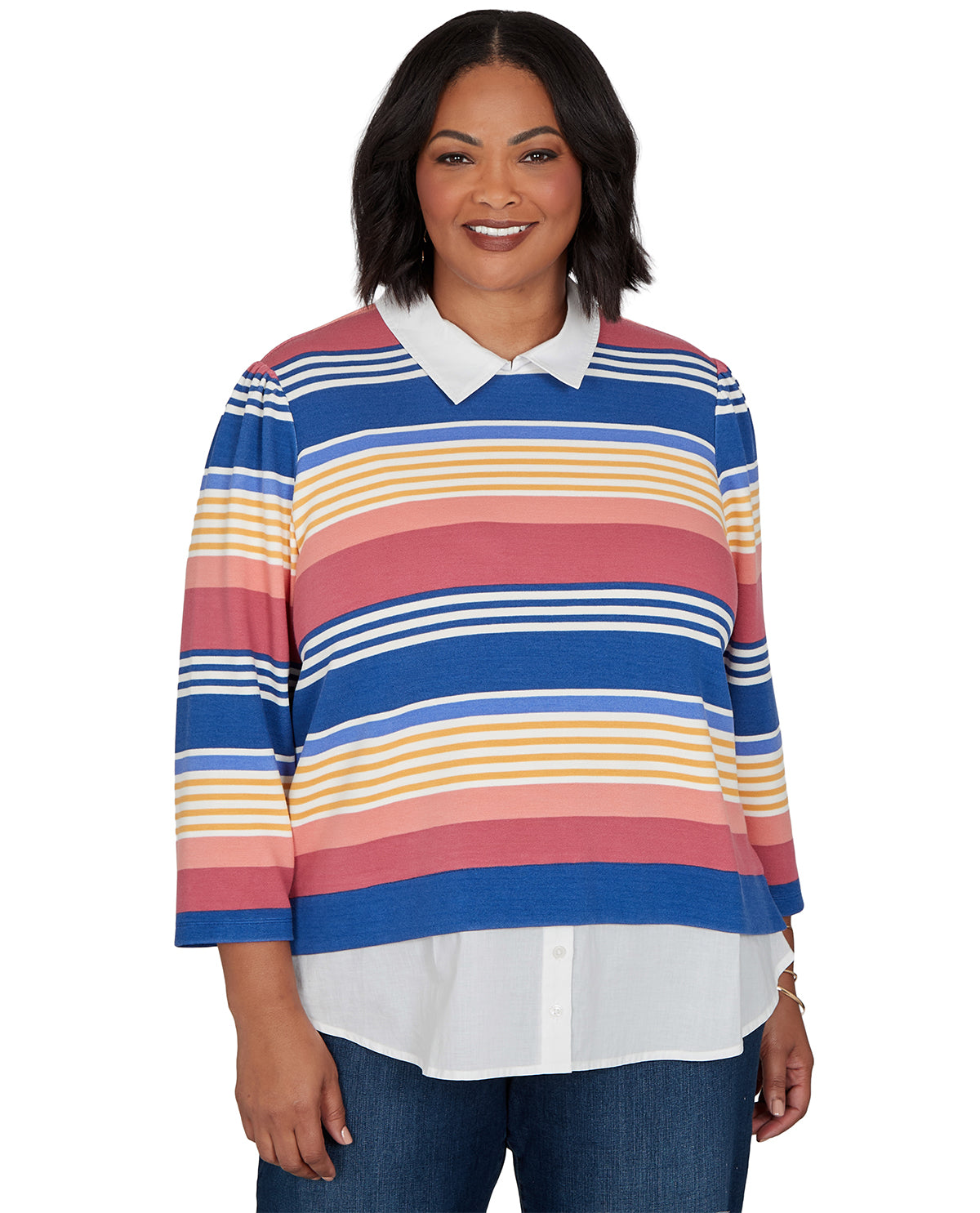 Woman wearing a colorful striped sweater with a white collar on a white background