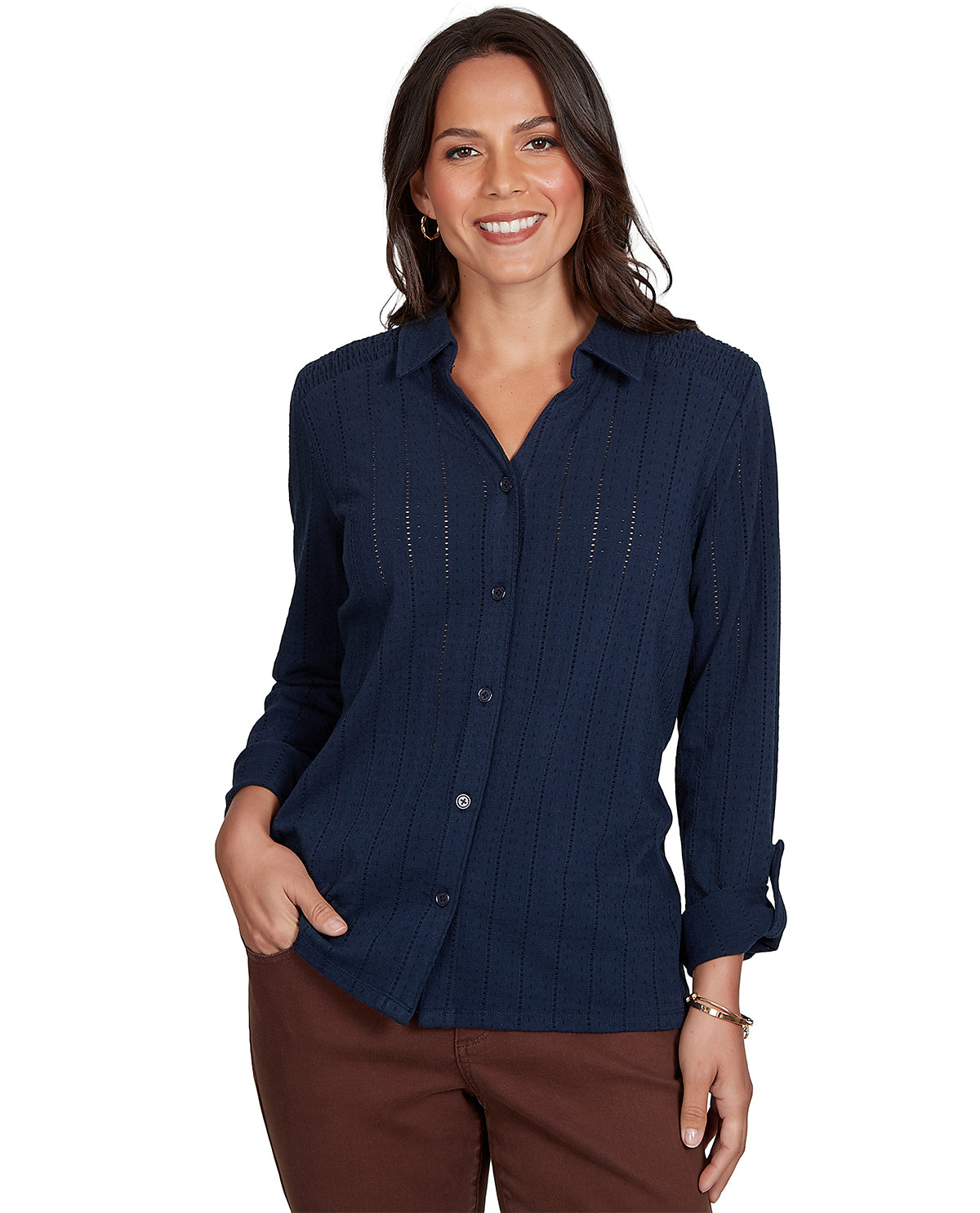 Woman wearing a navy blue button-up shirt on a white background