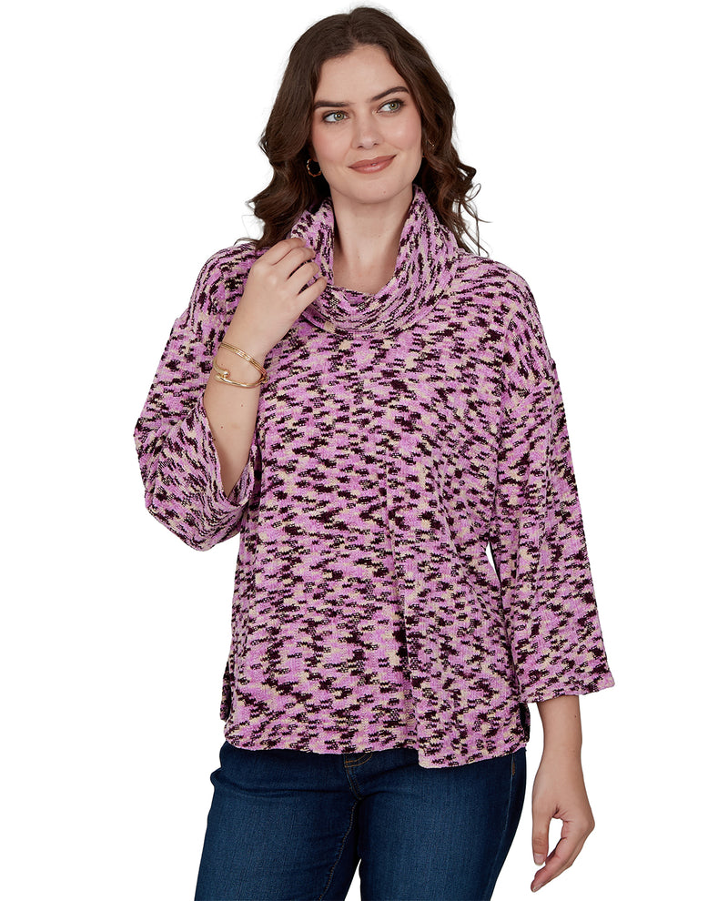 Woman wearing a pink leopard print top on a white background
