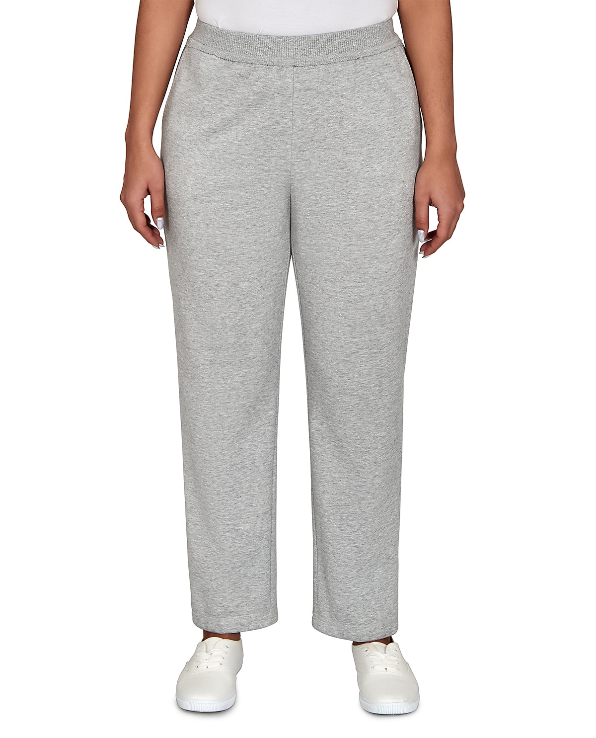 A person wearing light heather gray wide-leg sweatpants with a white top and white sneakers, shown from the waist down against a plain white background.