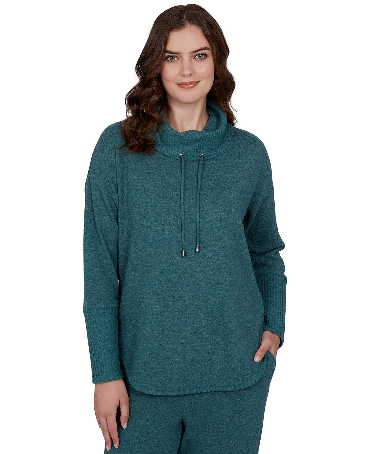 Woman wearing a teal sweater with a white background