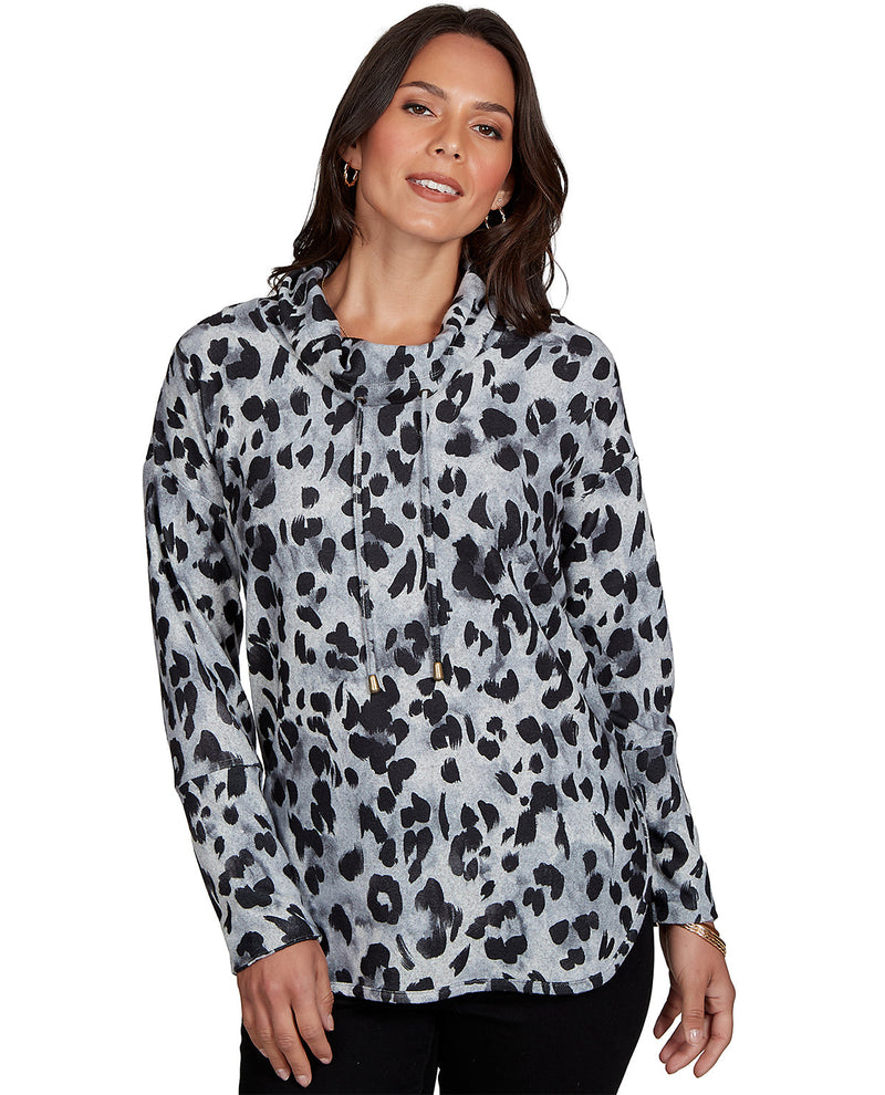 Woman wearing a leopard print hoodie on a white background