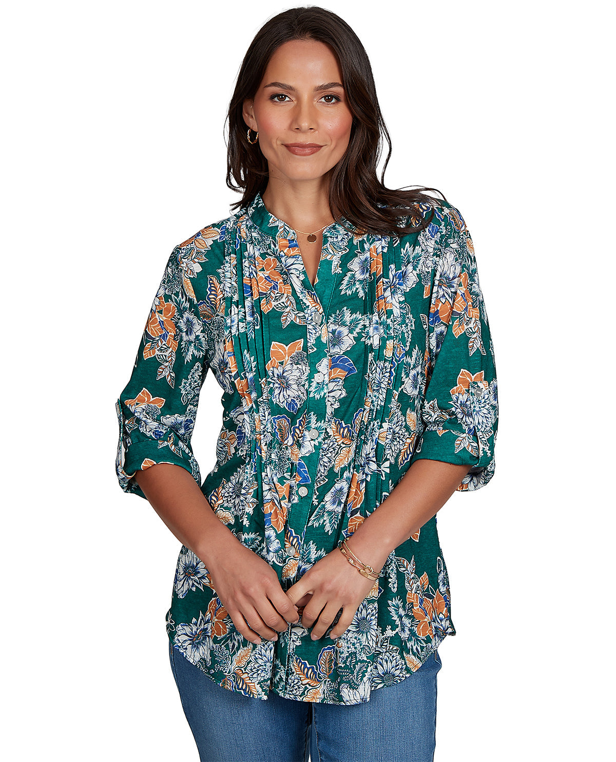Woman wearing a petite floral blouse with a white background