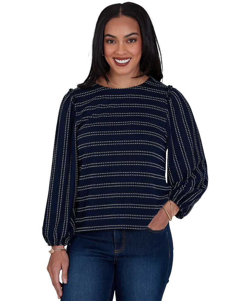 Woman wearing a petite navy blue and white striped long-sleeve top on a white background