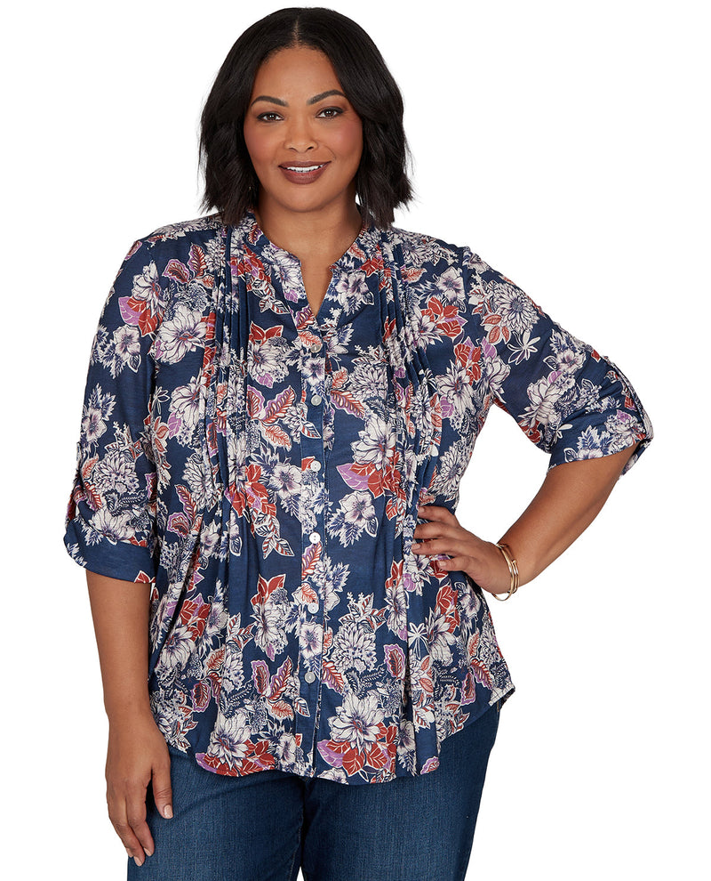 Woman wearing a floral blouse with a white background