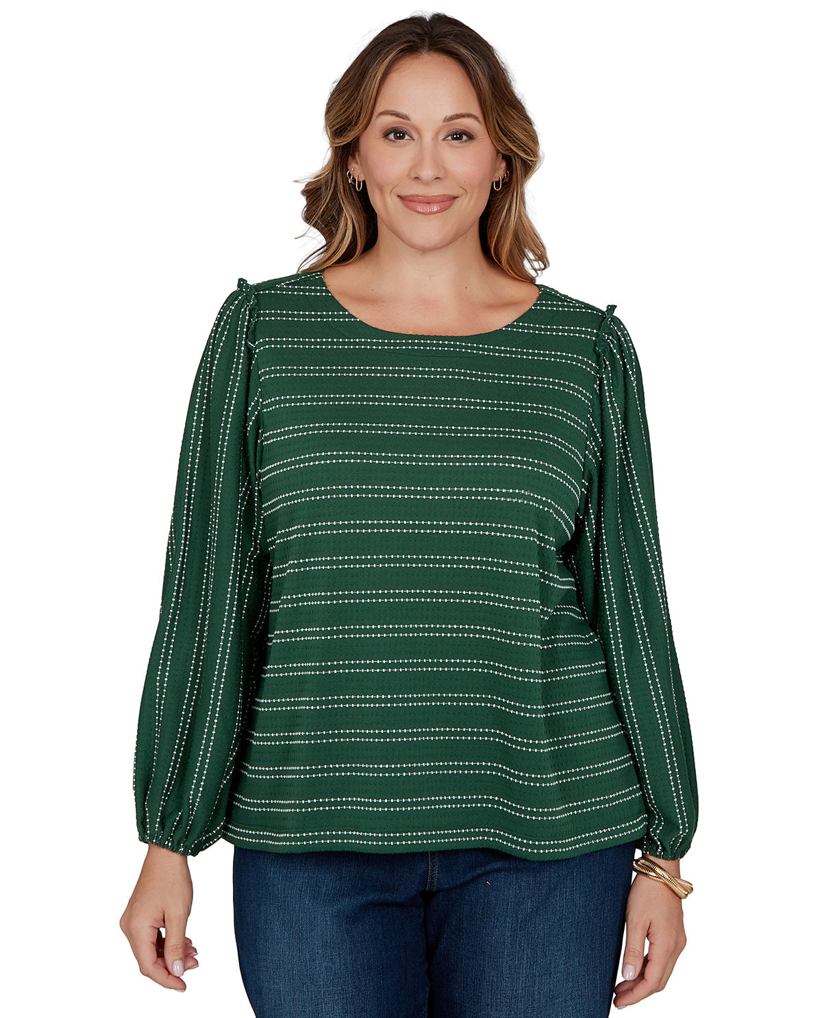 Woman wearing a green patterned blouse on a white background