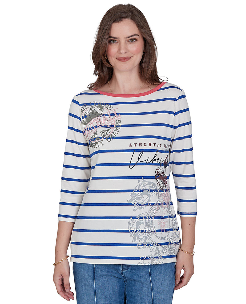 Woman wearing a petite blue and white striped shirt with graphic designs on a white background