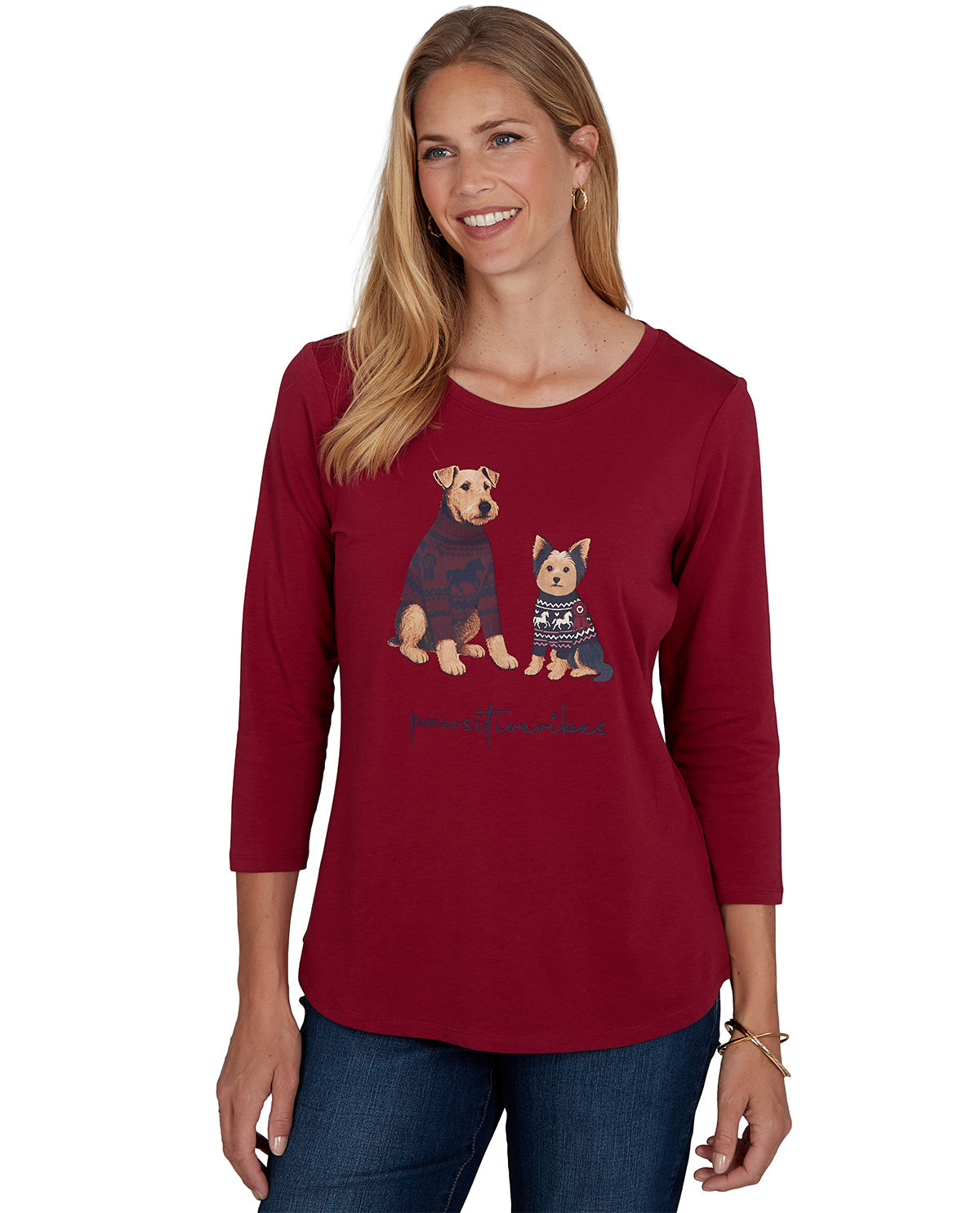 Woman wearing a red long-sleeve shirt with dog graphics on a white background