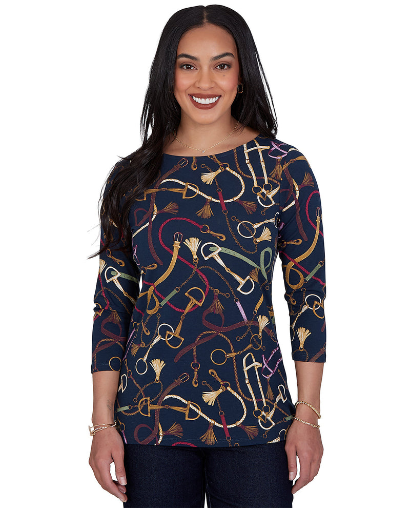 Woman wearing a navy blue top with colorful pattern on a white background
