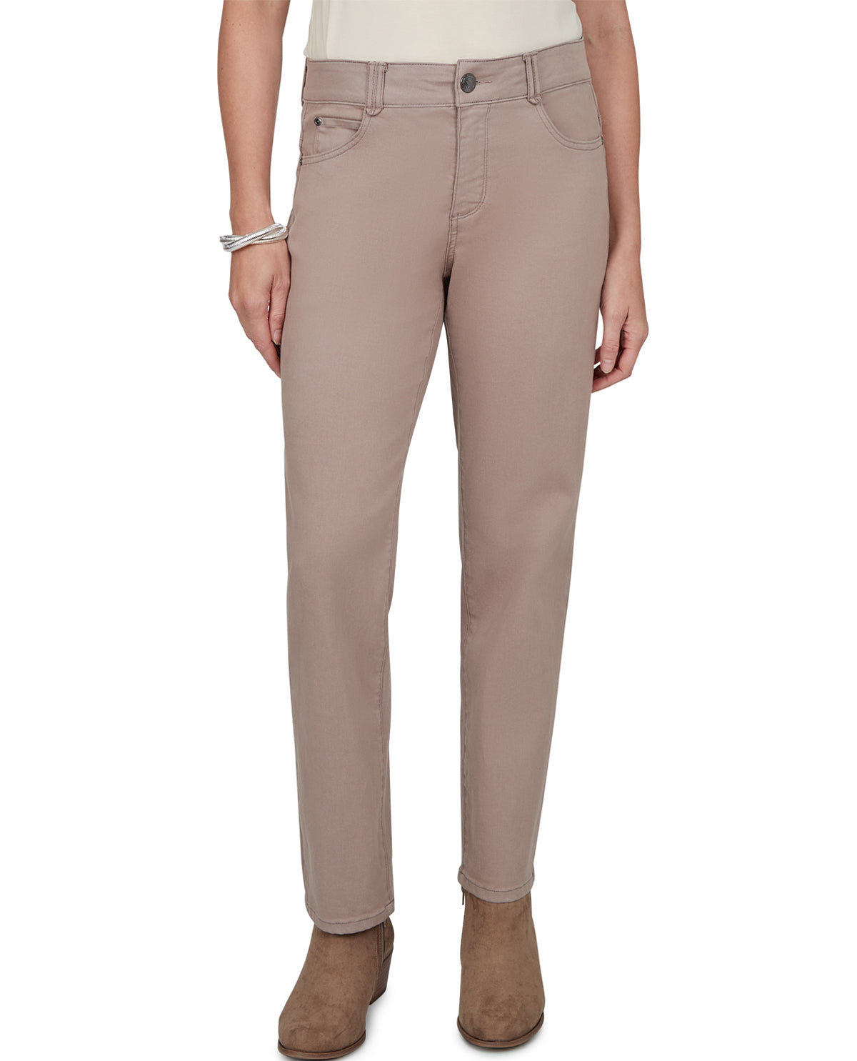 A model wearing a pair of slim-fit, straight-leg jeans in a muted taupe-beige color, paired with brown suede ankle boots against a plain white background.