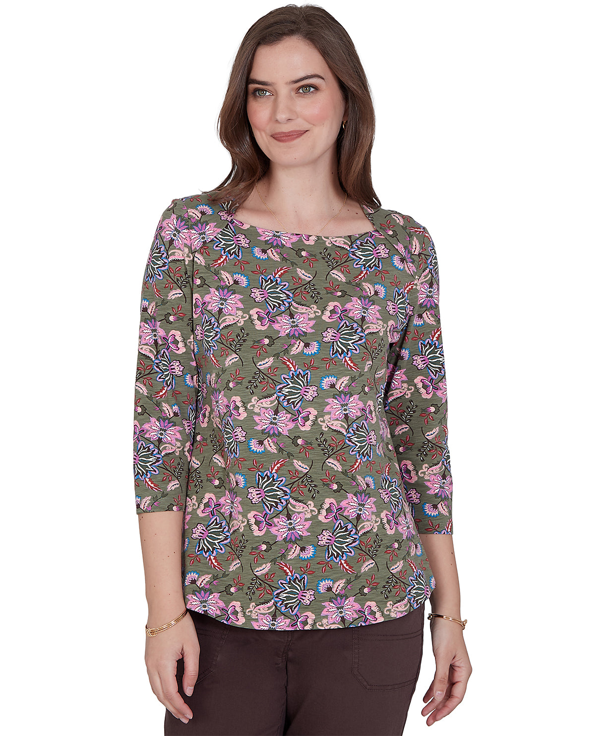 Woman wearing a floral patterned shirt on a white background