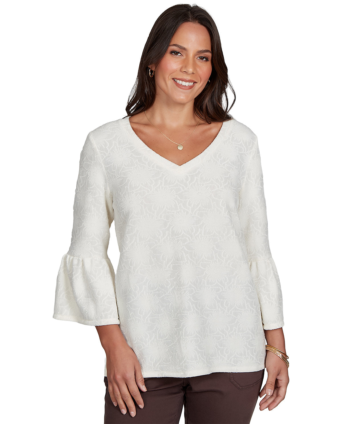 Woman wearing a white blouse with bell sleeves on a white background