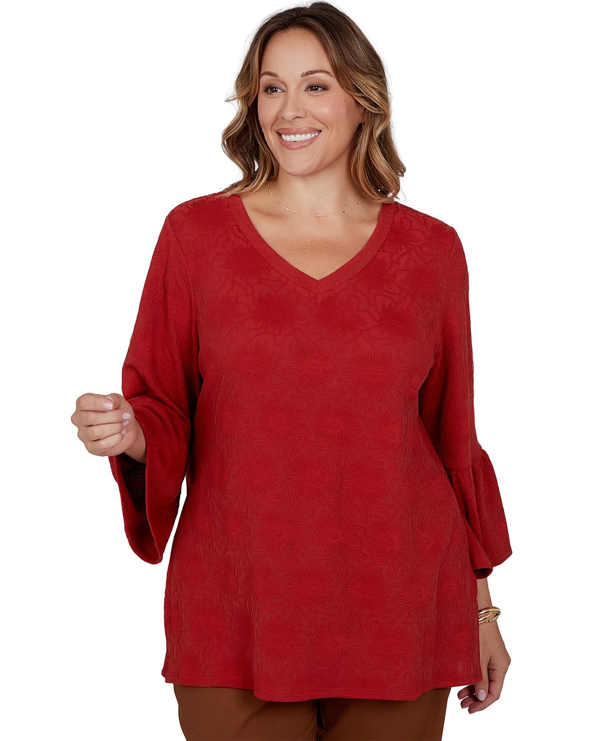 Woman wearing a red dress with long sleeves on a white background