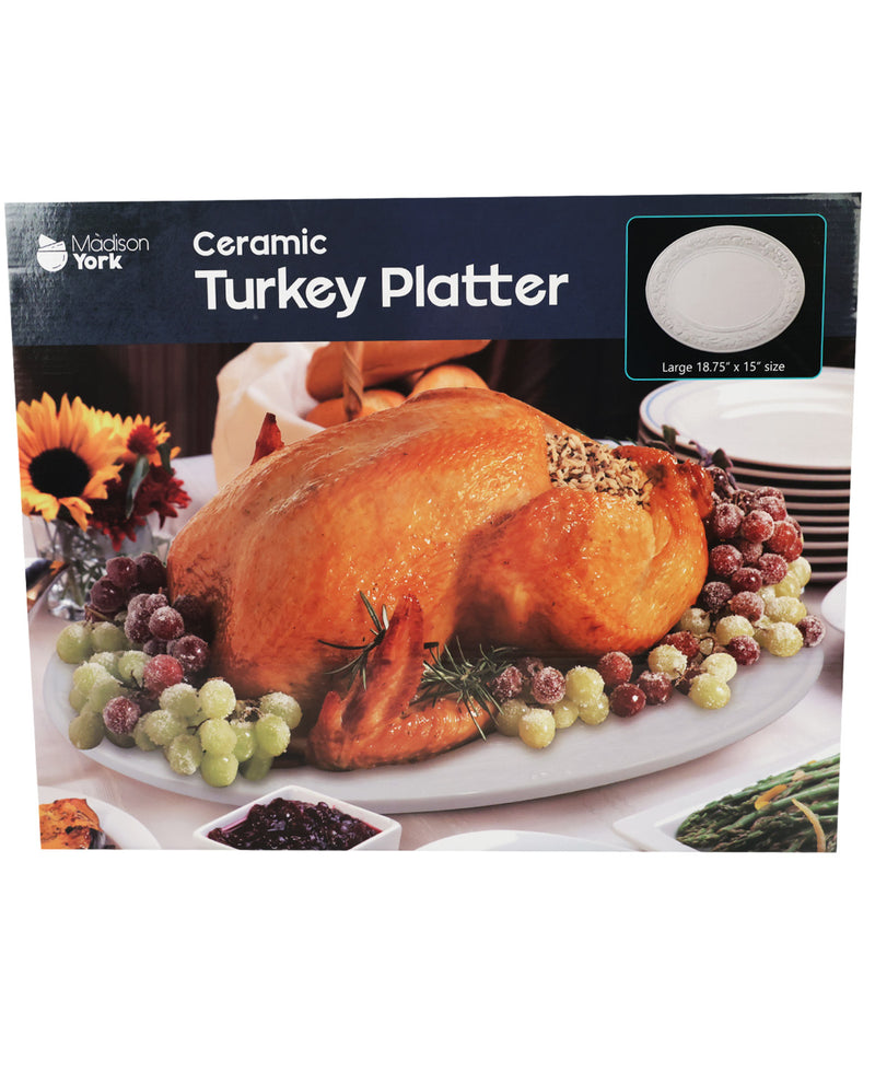 A boxed ceramic turkey platter shown on a white background. The packaging features a photo of a roasted turkey on a white oval platter, with the text 'Ceramic Turkey Platter' and a small inset showing the stackable white plates.