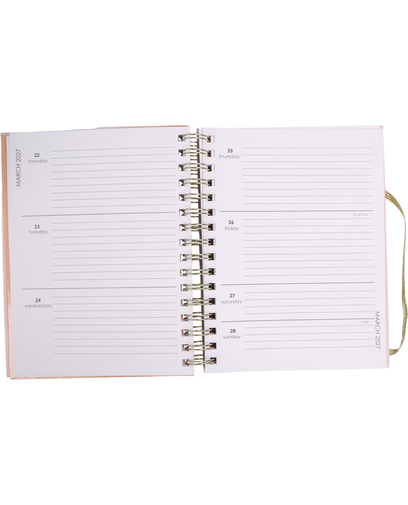 Open planner with monthly layout on white background