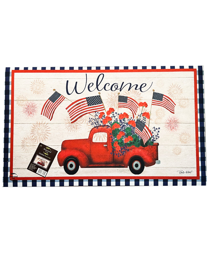 Decorative mat with a red truck, American flags, and 'Welcome' text on a white background.