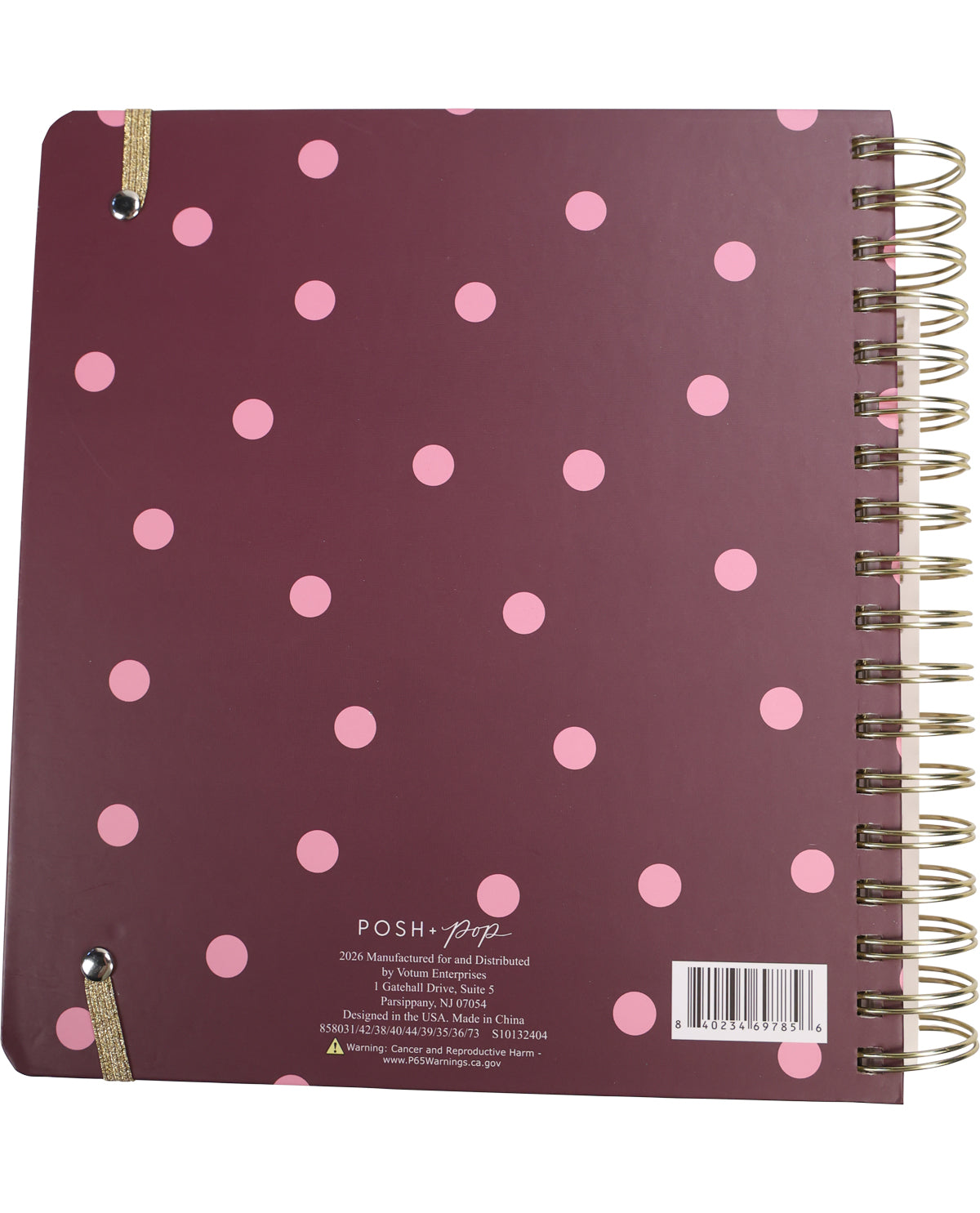 Plum-colored spiral-bound notebook with pink polka dots on a white background