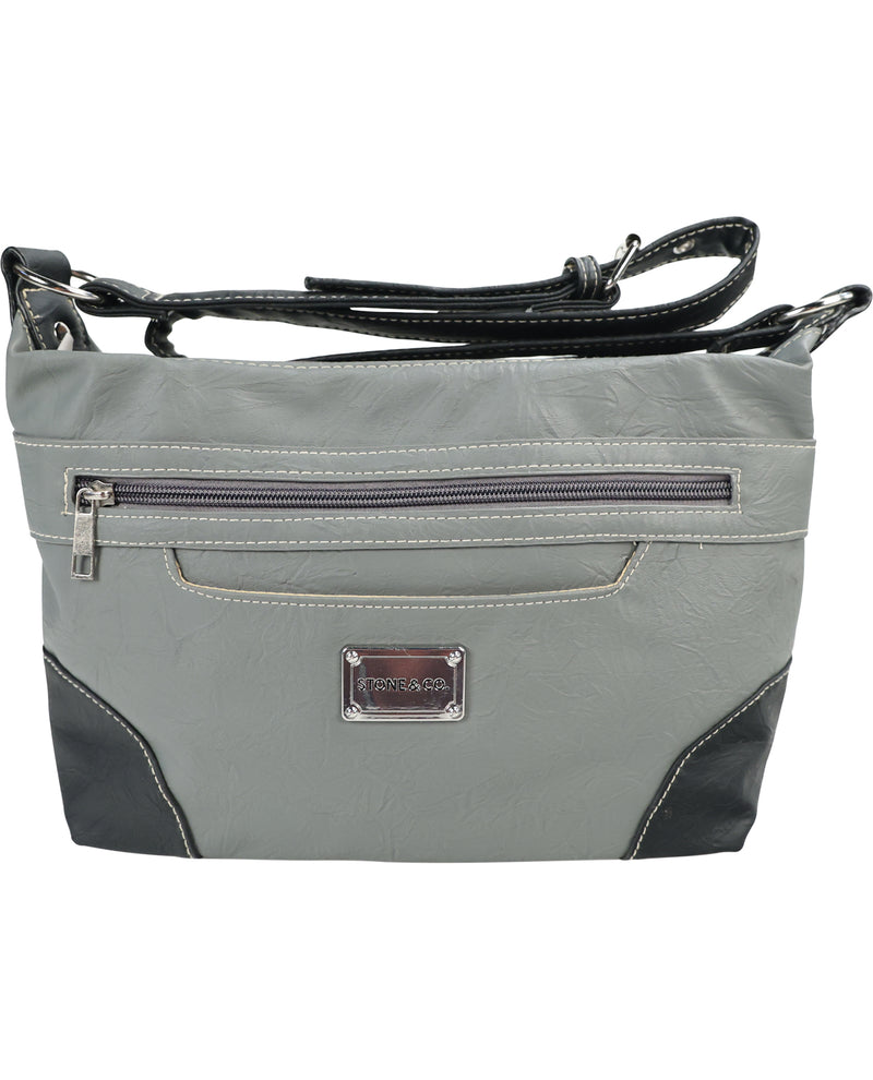 A gray faux-leather shoulder bag with black leather accents, a black shoulder strap, and a silver-tone metal brand plate on the front.