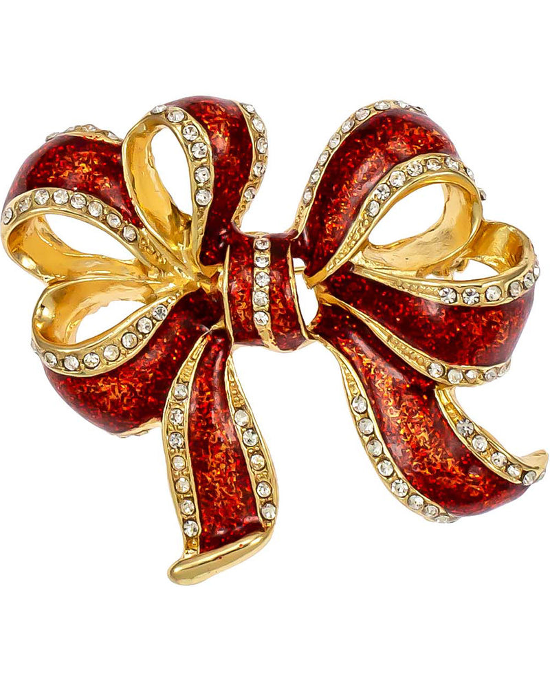 A large bow-shaped brooch with textured red enamel and gold-tone metal, accented with clear rhinestones along the edges, shown on a plain white background.