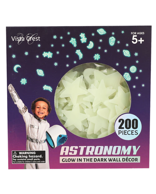Vista Crest Astronomy Glow in the Dark Wall Decor set in a purple box with a circular window showing pale green glow stars and shapes, plus a child astronaut illustration and '200 PIECES' badge.