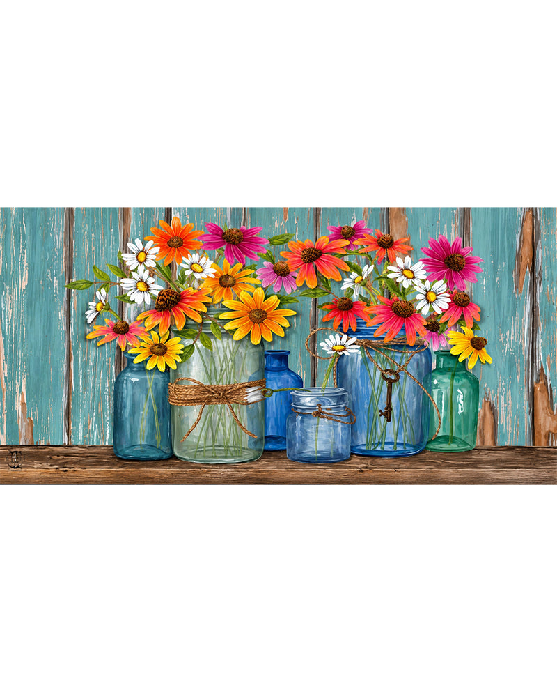 Colorful flowers in jars on a wooden surface with a wooden fence background