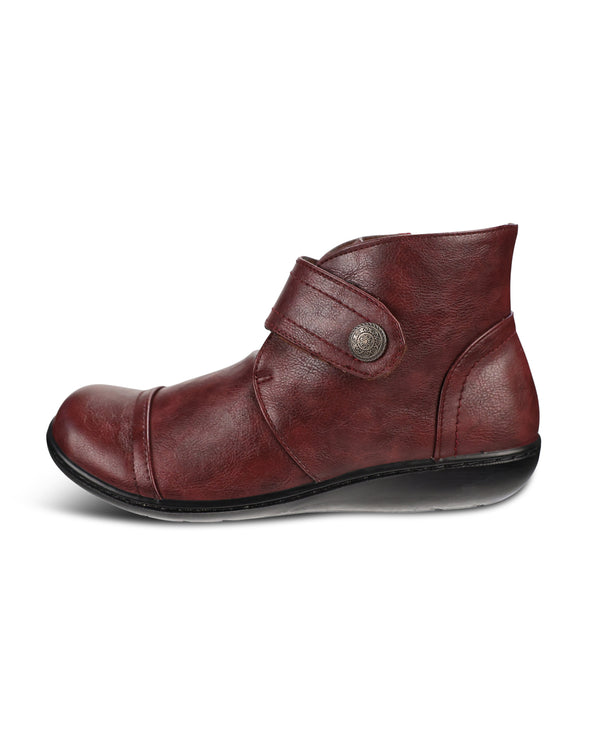 A single dark red leather ankle boot with a strap closure and a decorative metal button, shown from a side profile on a white background.
