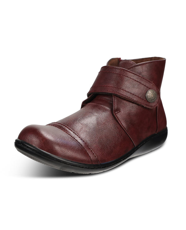 A single dark red leather ankle boot with a strap closure and a decorative metal button, shown from a side profile on a white background.