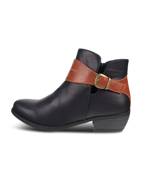 A single women's ankle boot in Navypebbled leather with a contrasting brown leather strap across the ankle and a gold-tone buckle, shown from a side profile on a white background.