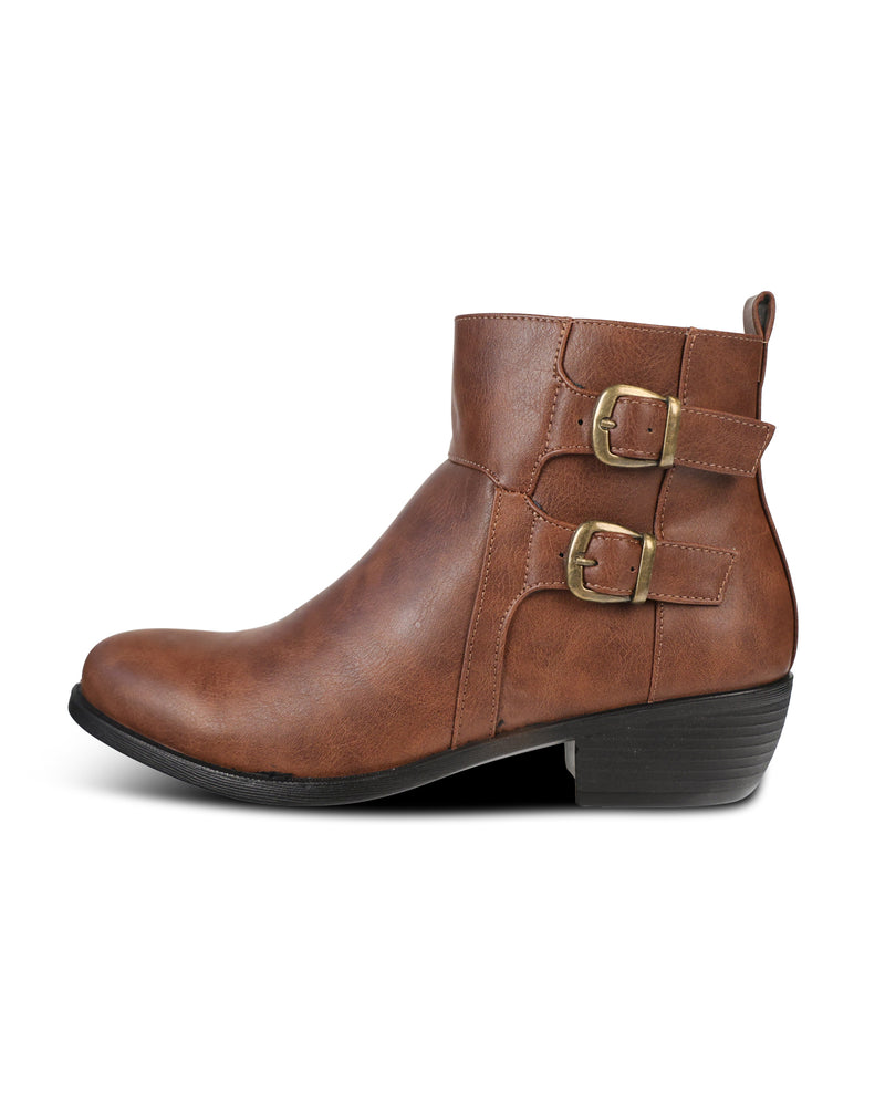 A brown ankle boot with two decorative buckle straps on the side, a low block heel, and a black sole, shown against a plain white background.