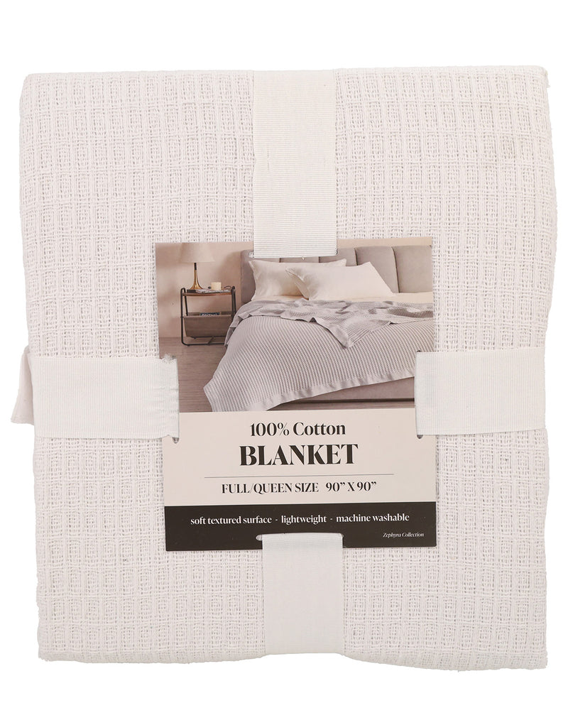 A folded white textured cotton blanket with a paper label showing a bedroom photo and text that reads '100% Cotton BLANKET' and 'FULL QUEEN SIZE: 90" x 90"'.