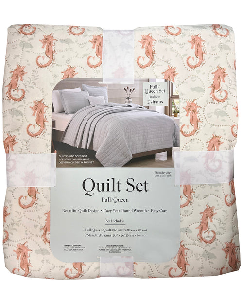 Packaged quilt set with seahorse pattern and product label on a white background