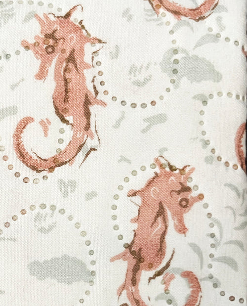 Pattern of seahorses on a textured fabric background