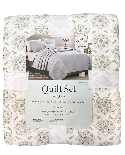 Packaged quilt set with floral pattern and bedding image on packaging