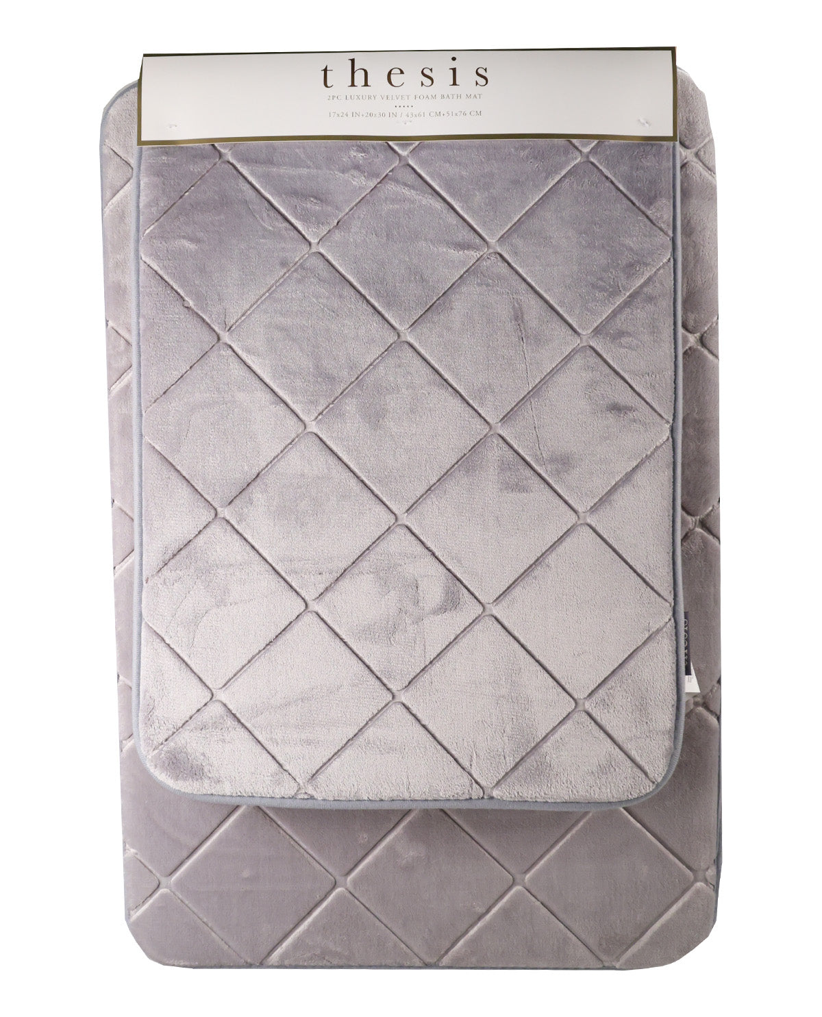 A light gray quilted velvet blanket with a diamond pattern, folded over a matching gray quilted blanket underneath, and packaged with a white header card labeled 'thesis'.