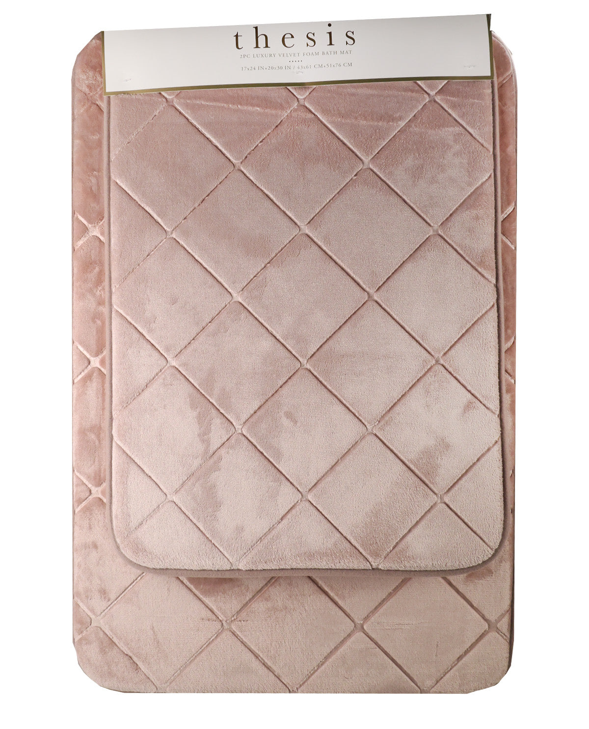 A dusty pink quilted velvet blanket with a diamond pattern, folded to show its texture and a white paper header card at the top that reads 'thesis'.