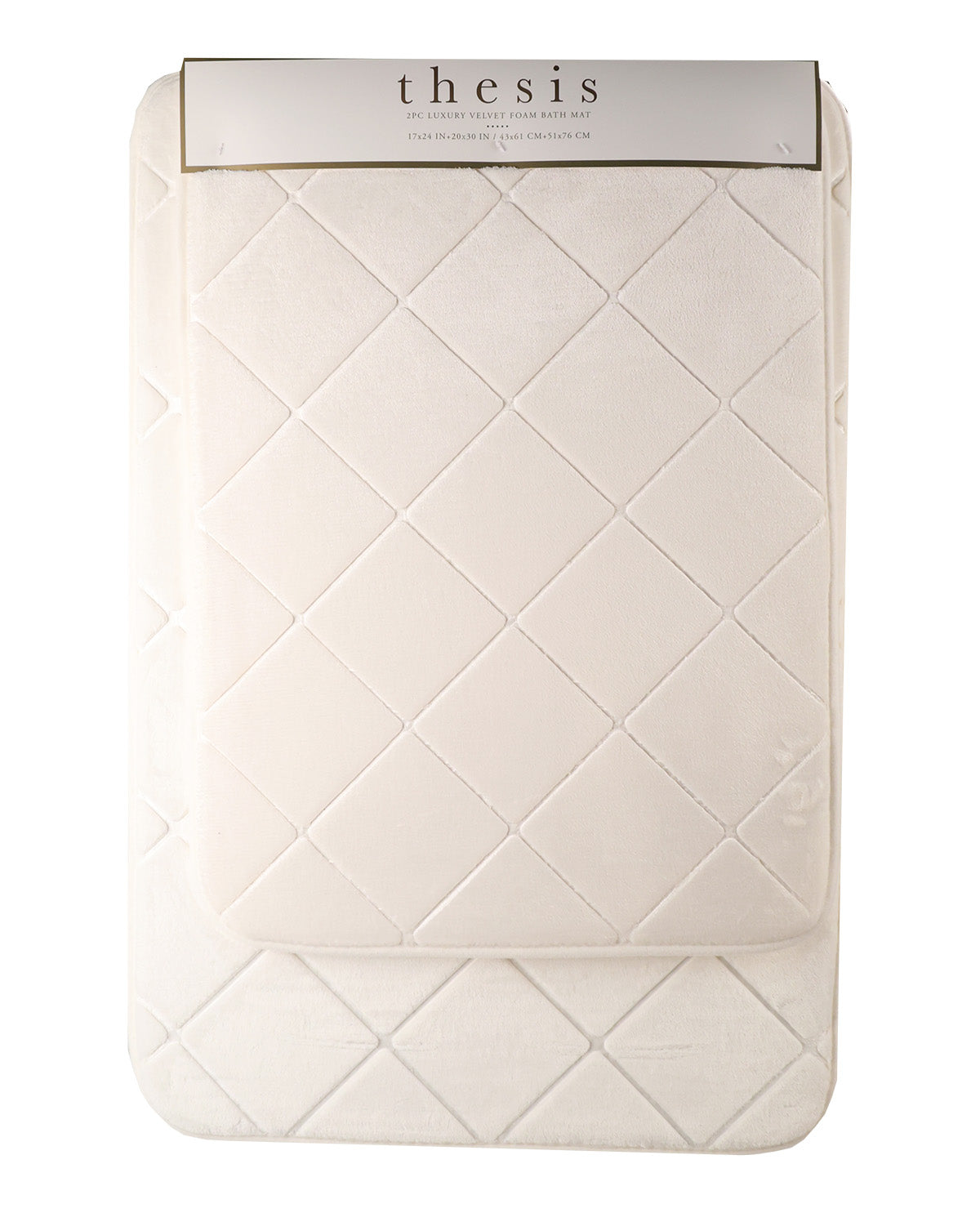 A cream-colored quilted baby blanket with a diamond pattern, folded over a matching cream quilted mattress protector, with a white paper header card at the top displaying the brand name 'thesis'.